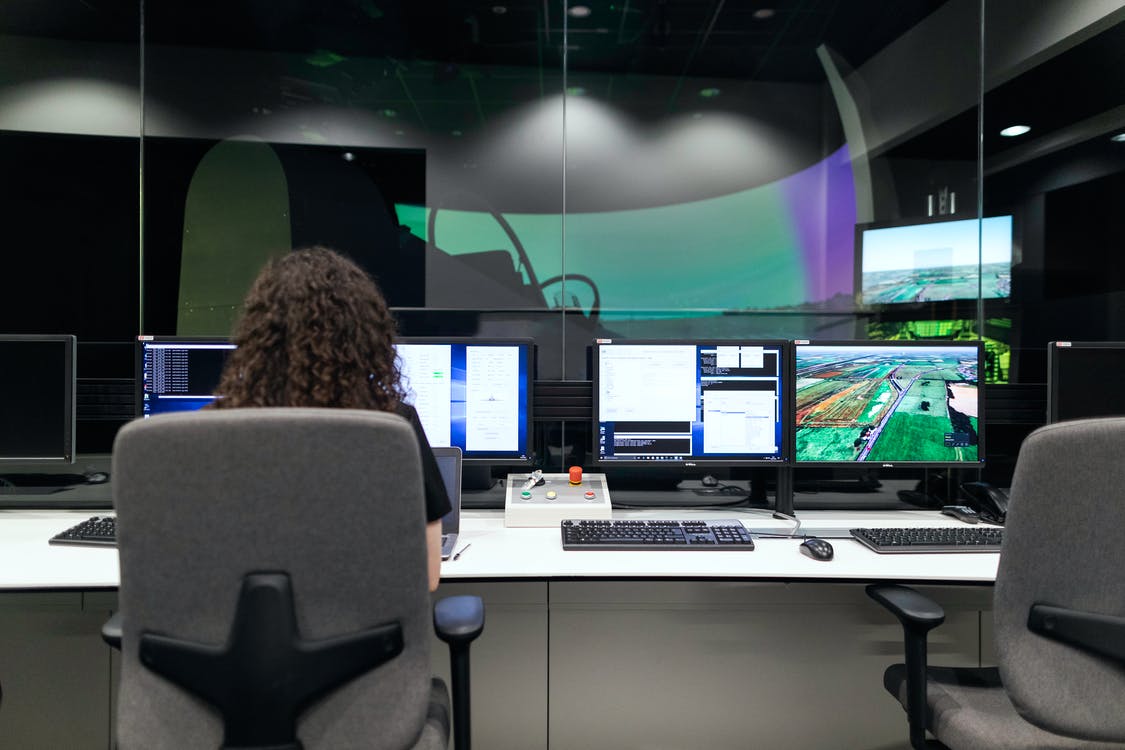 A woman working on access and key control software