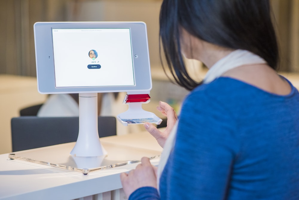 Woman using a visitor management system in Dubai